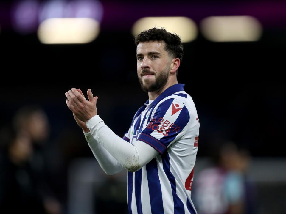 Mikey Johnston applauding Albion fans after the game at Burnley
