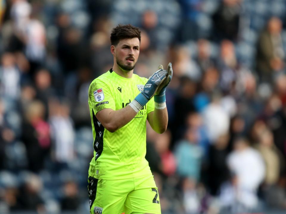 Joe Wildsmith applauds Albion fans after the QPR game