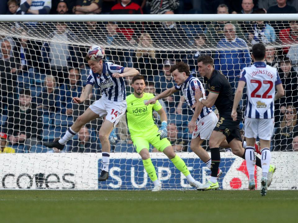 Torbjørn Heggem heading the ball clear against QPR 