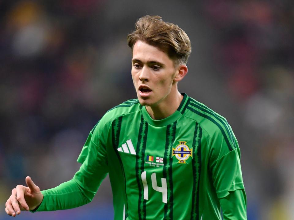 Isaac Price in action for Northern Ireland in their home kit 