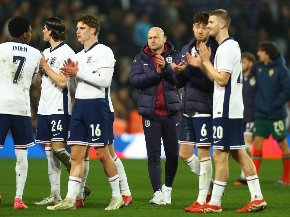 England U21 players and boss Lee Carsley applaud England fans after beating Portugal at The Hawthorns