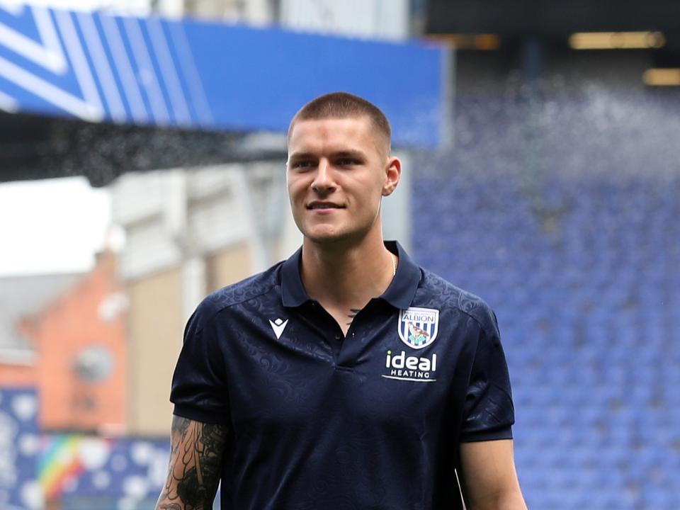 Ted Cann smiling while wearing WBA polo shirt 