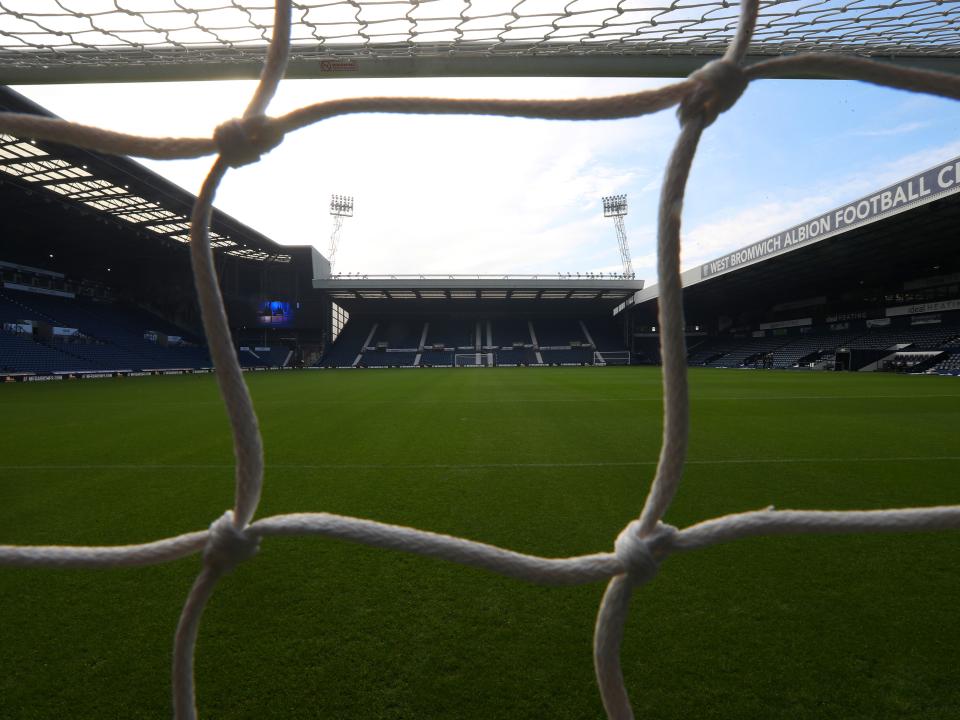 An image of The Hawthorns from the Birmingham Road End, looking through the net