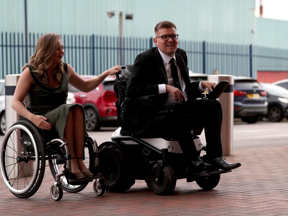 Powerchair footballer Chris Gordon arriving in a suit to the end of season awards dinner at The Hawthorns