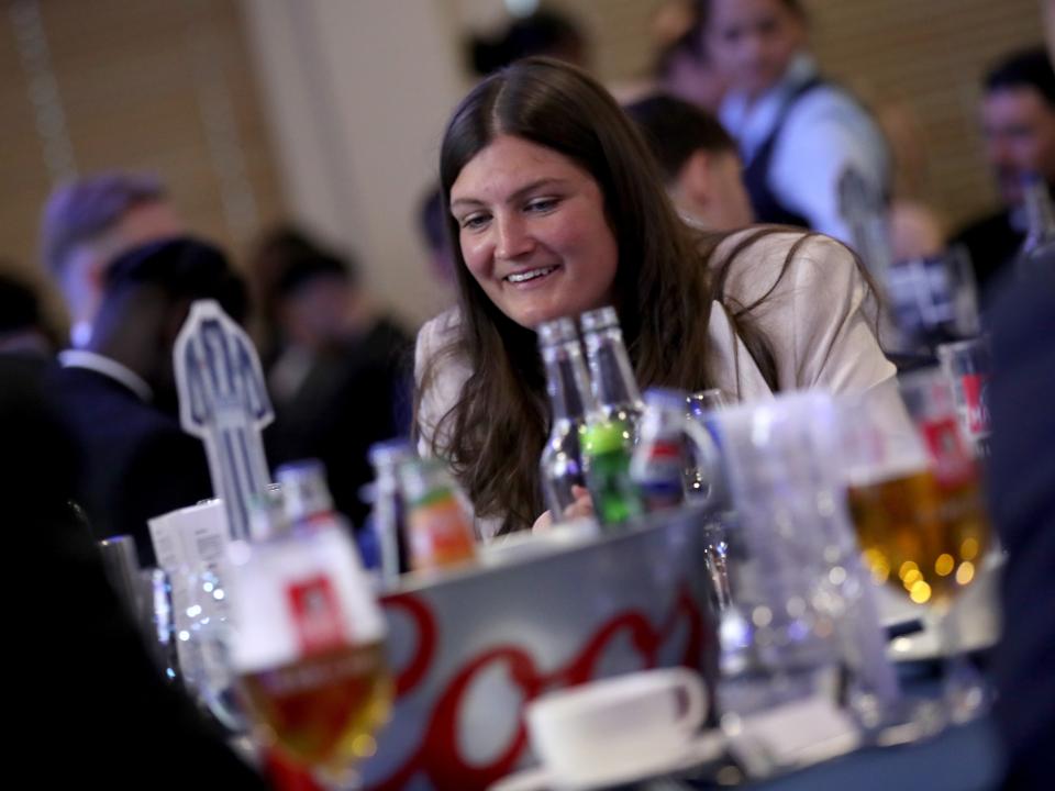 Siobhan Hodgetts-Still sat at a table at the end of season awards dinner