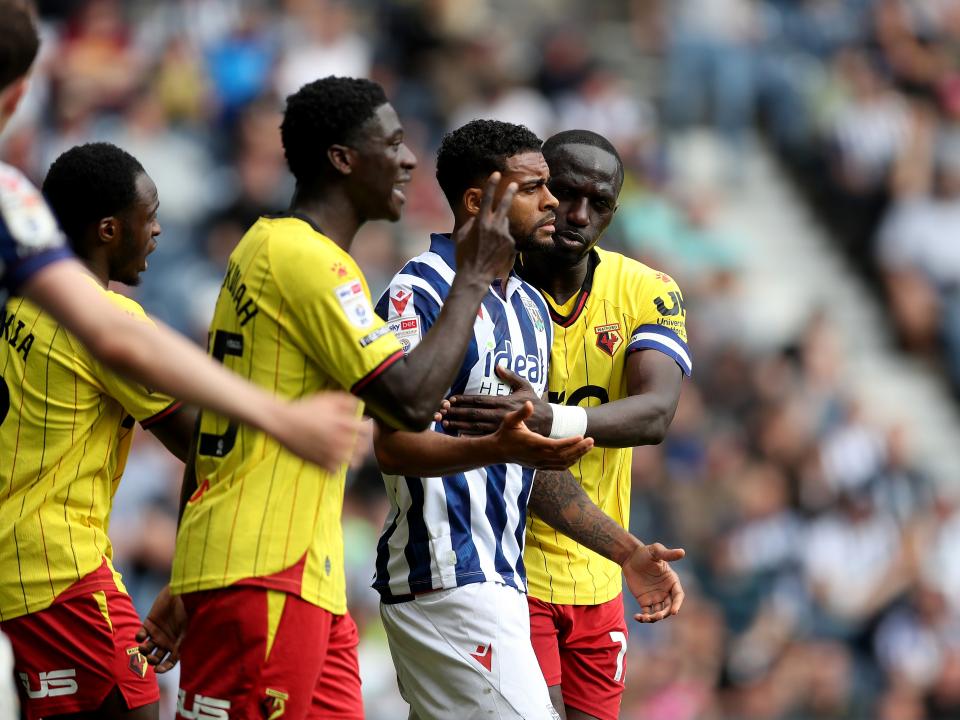 Darnell Furlong surrounded by Watford players 