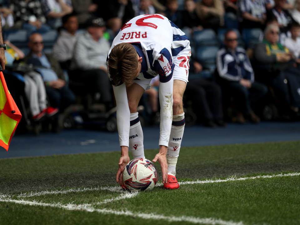 Isaac Price placing the ball down to take a corner against Watford