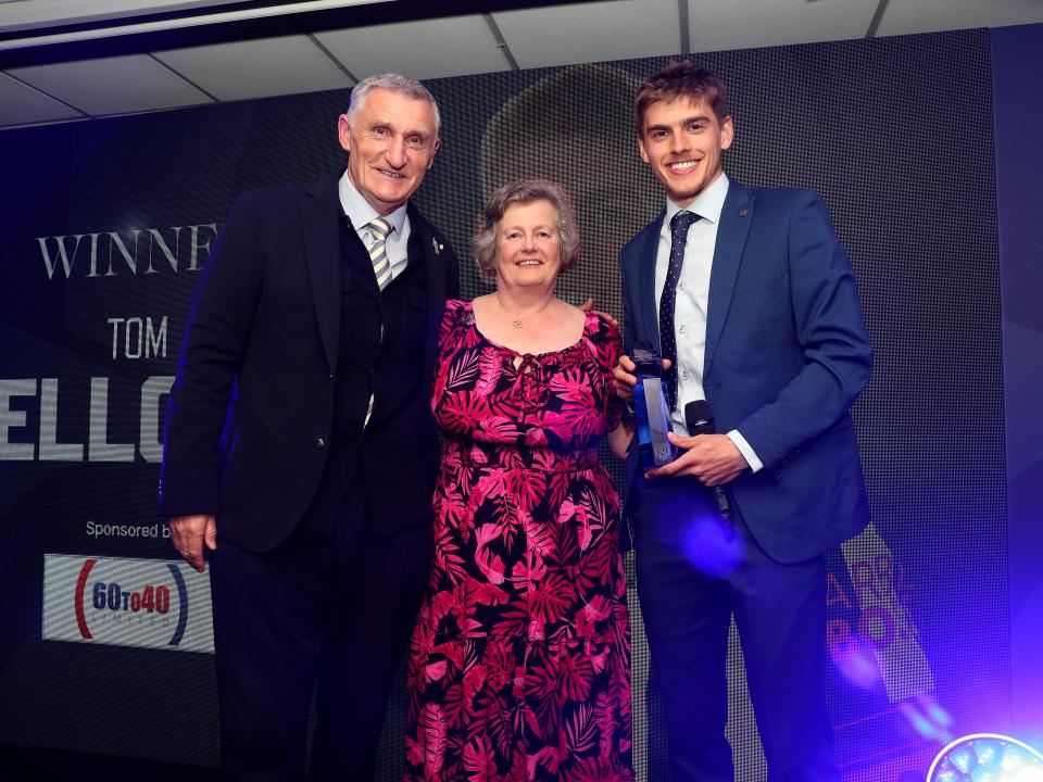 Tony Mowbray and Tom Fellows pose for a photo with a sponsor on stage at the end of season awards dinner