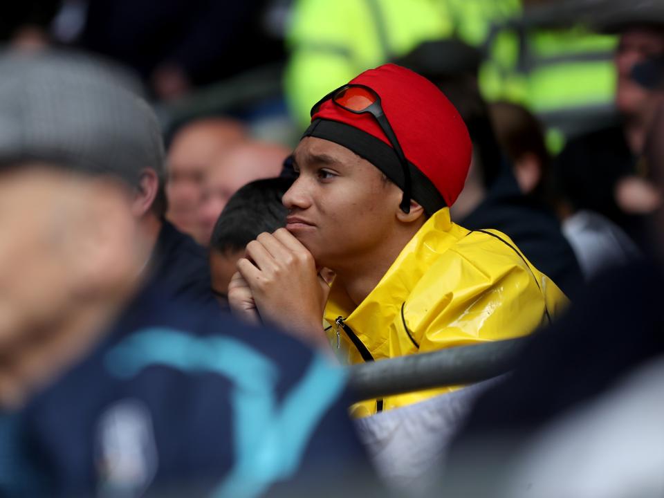 An Albion fan in the away end at Cardiff