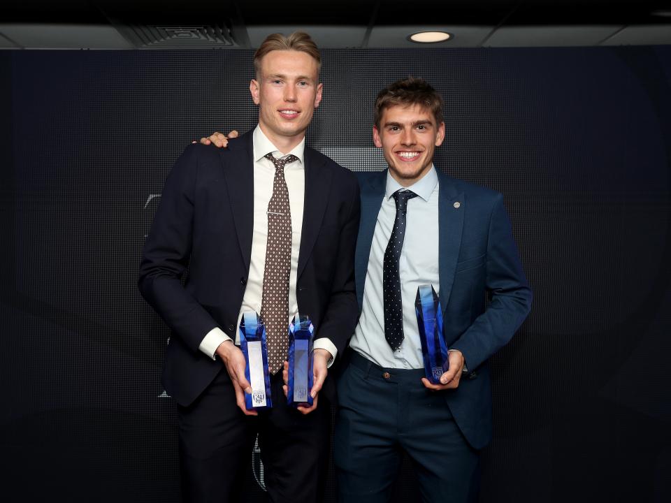 Torbjørn Heggem and Tom Fellows pose for a photo with their trophies at the end of season awards dinner