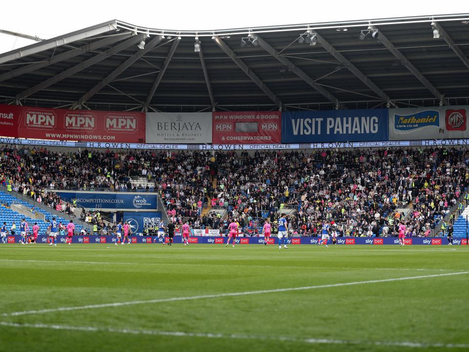 A general view from the opposite end of the pitch of over 3,000 Baggies in the away end at Cardiff 