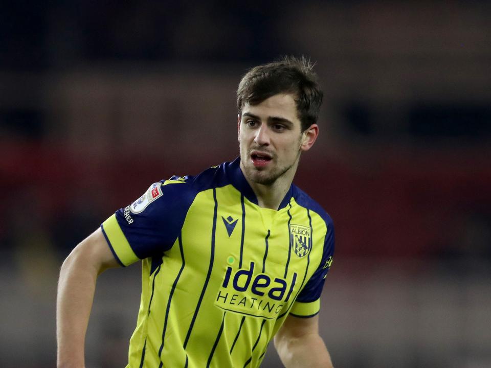 Jayson Molumby in action in the yellow and navy blue away kit 
