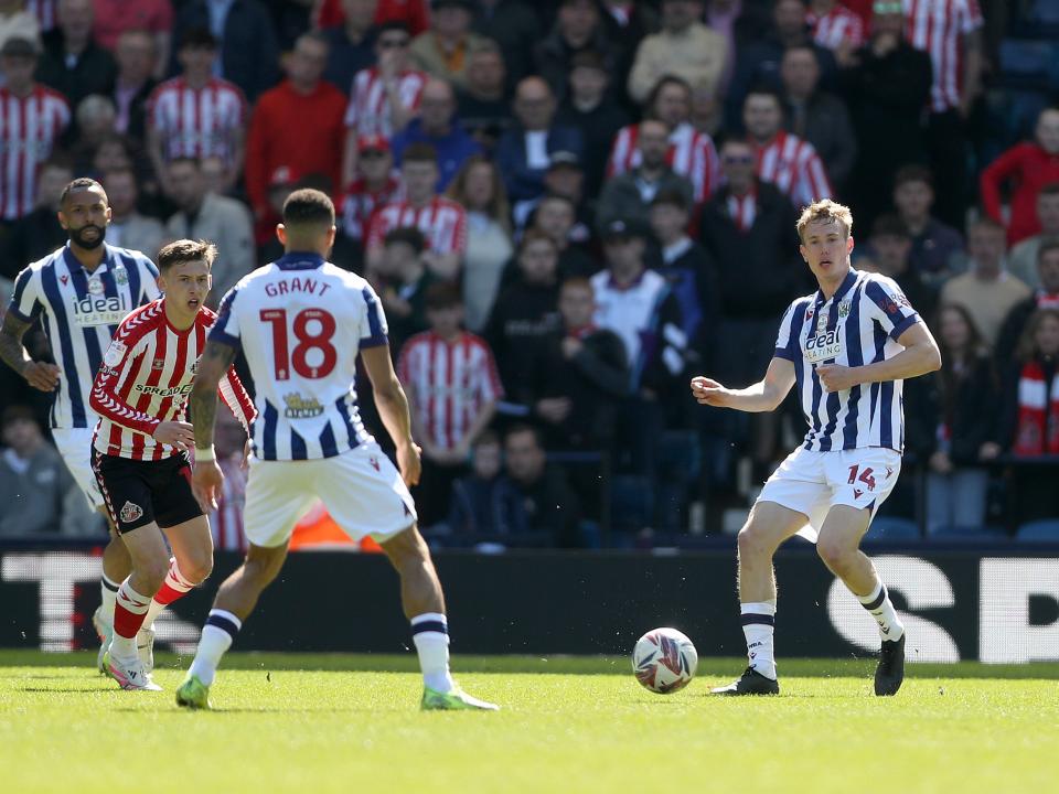 An image of Torbjorn Heggem passing the ball to Karlan Grant against Sunderland