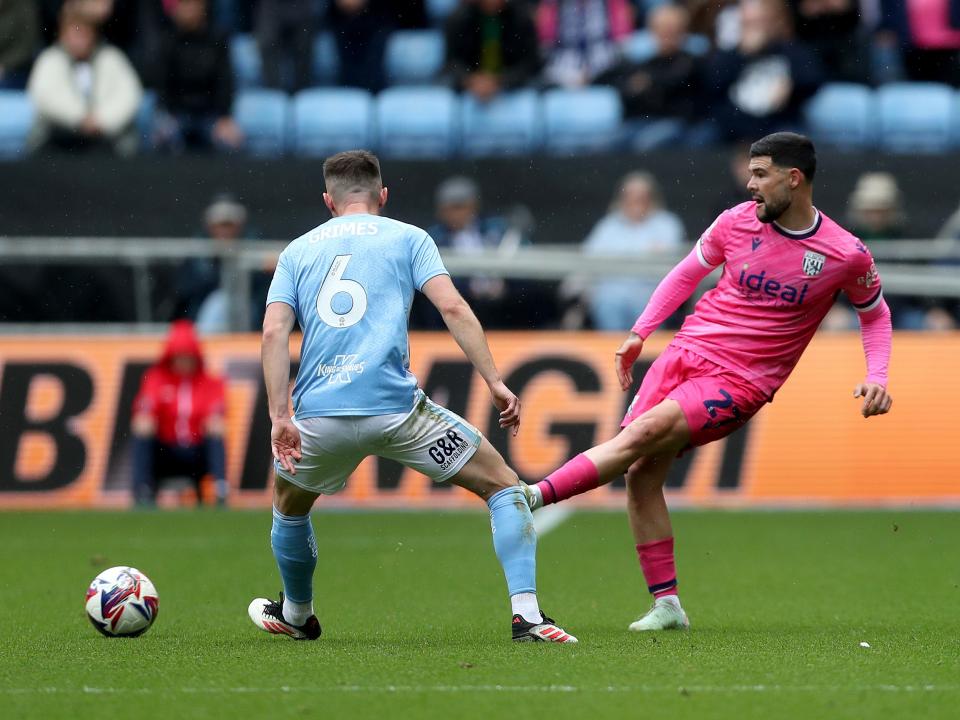 An image of Alex Mowatt passing the ball against Coventry