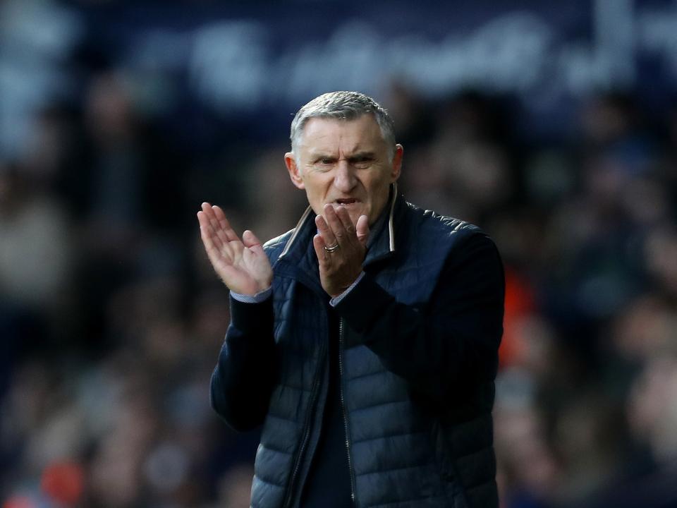Tony Mowbray clapping his hands on the side of a pitch