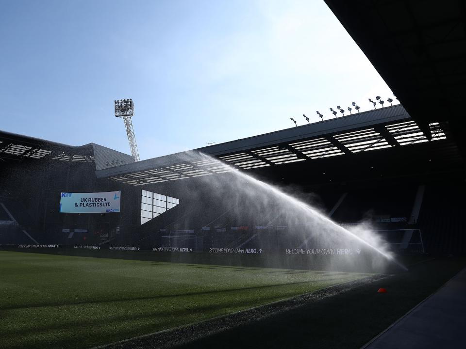 A general view of the Smethwick End at The Hawthorns with water being sprayed on the pitch 