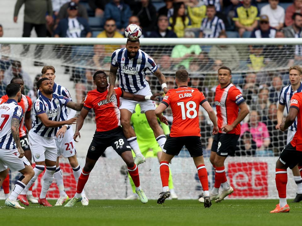 Kyle Bartley heads the ball clear against Luton Town