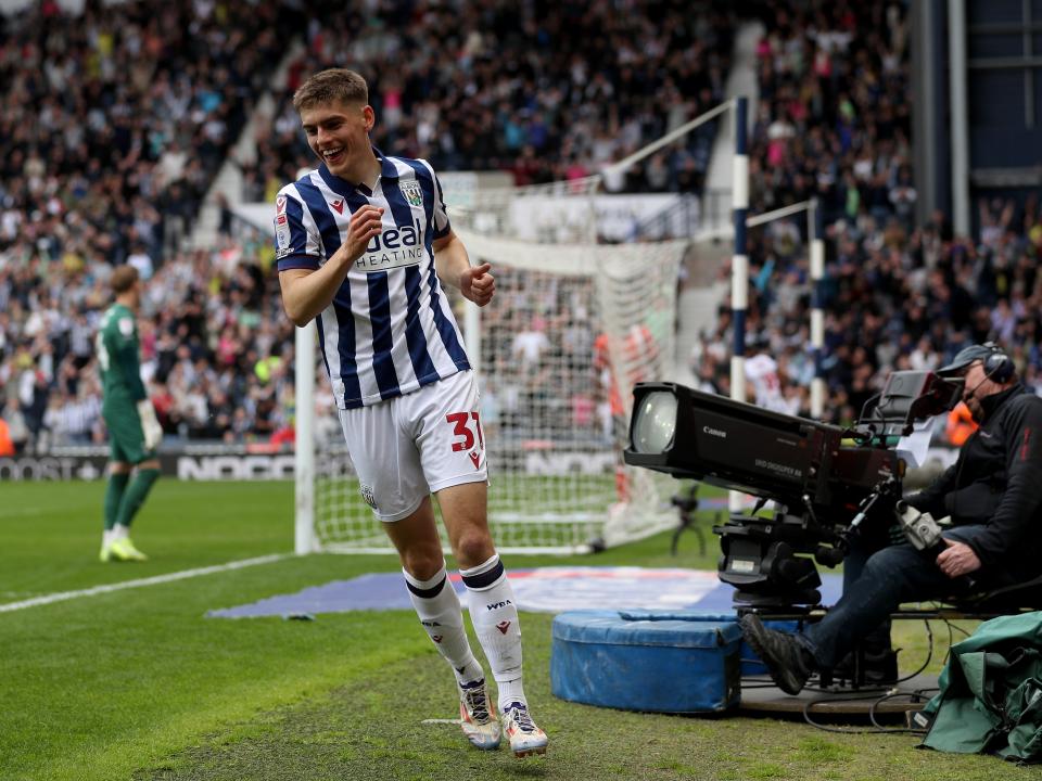 Tom Fellows celebrates alone after scoring against Luton Town