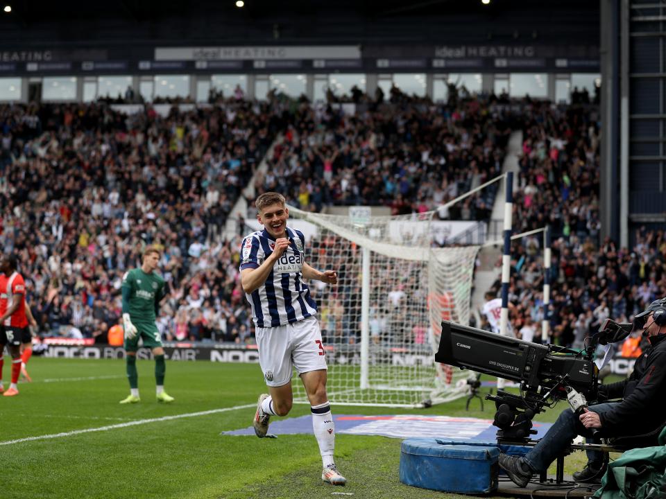 Tom Fellows celebrates alone after scoring against Luton Town