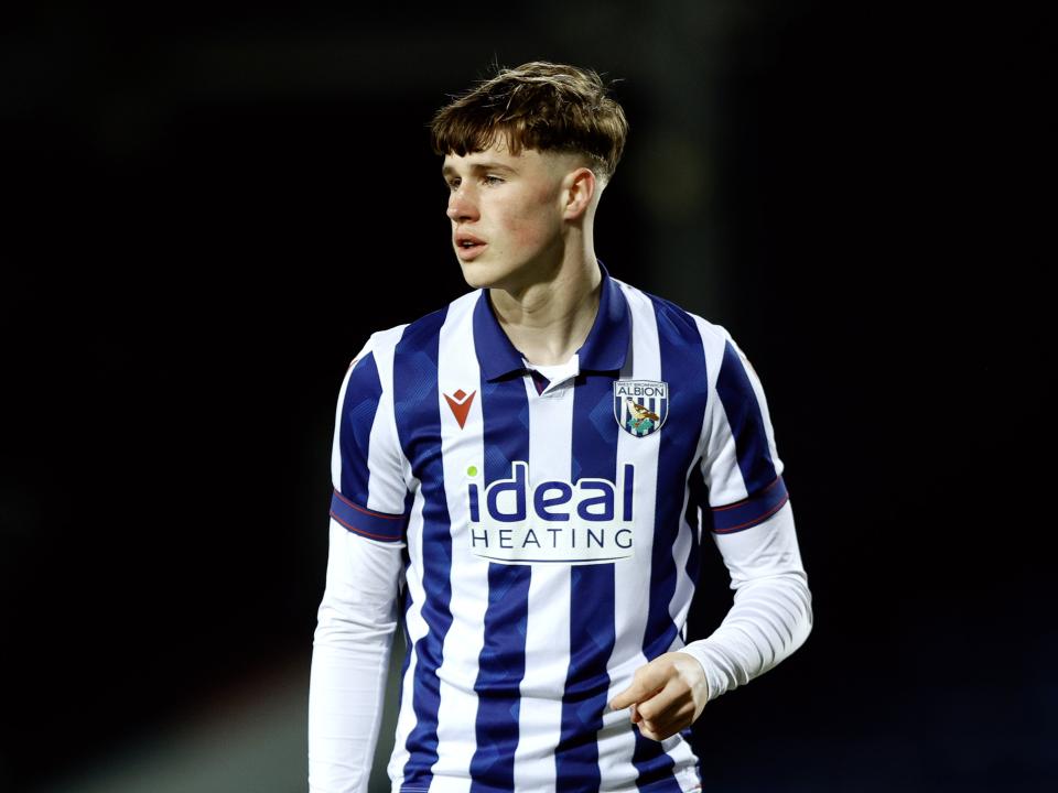 A photo of Albion U16 defender George Shaw in action for the U18s in the 2024/25 home kit