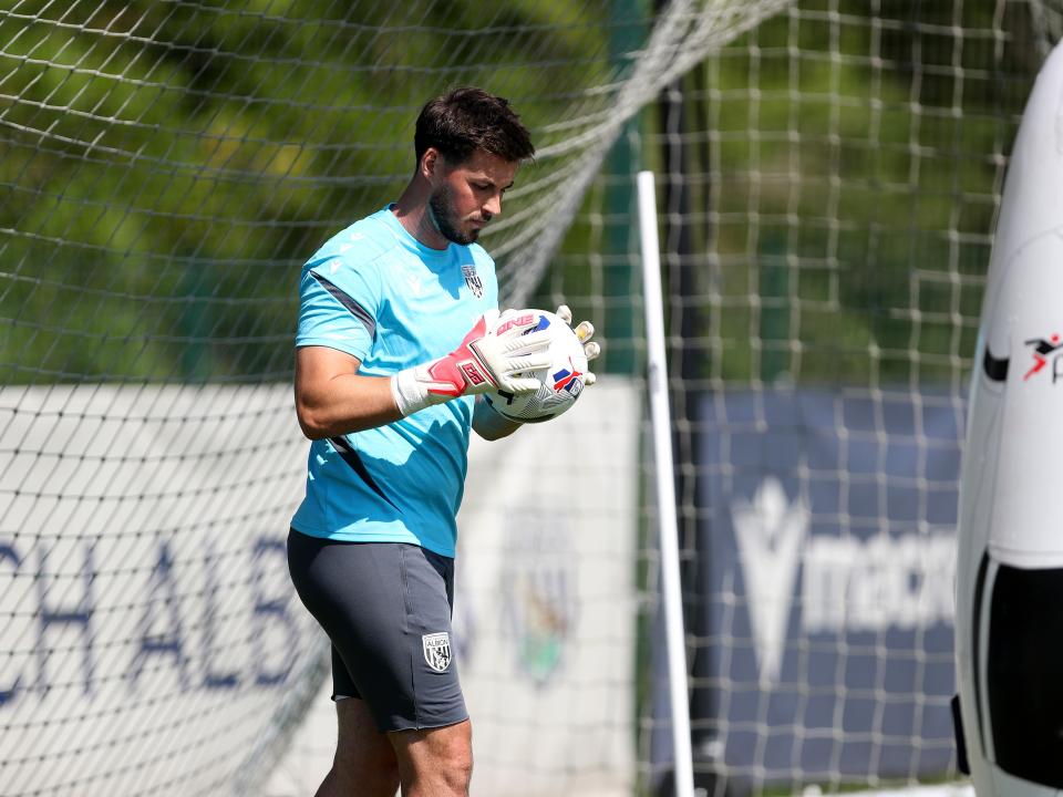 Joe Wildsmith holding a ball during a training session