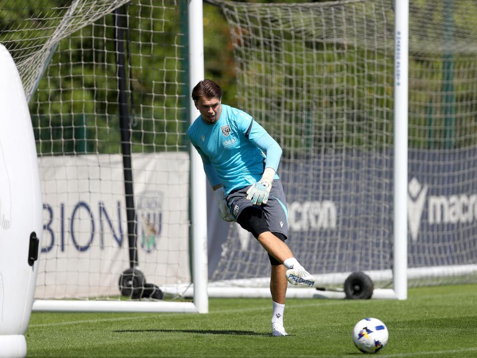 Josh Griffiths passing a ball during a training session