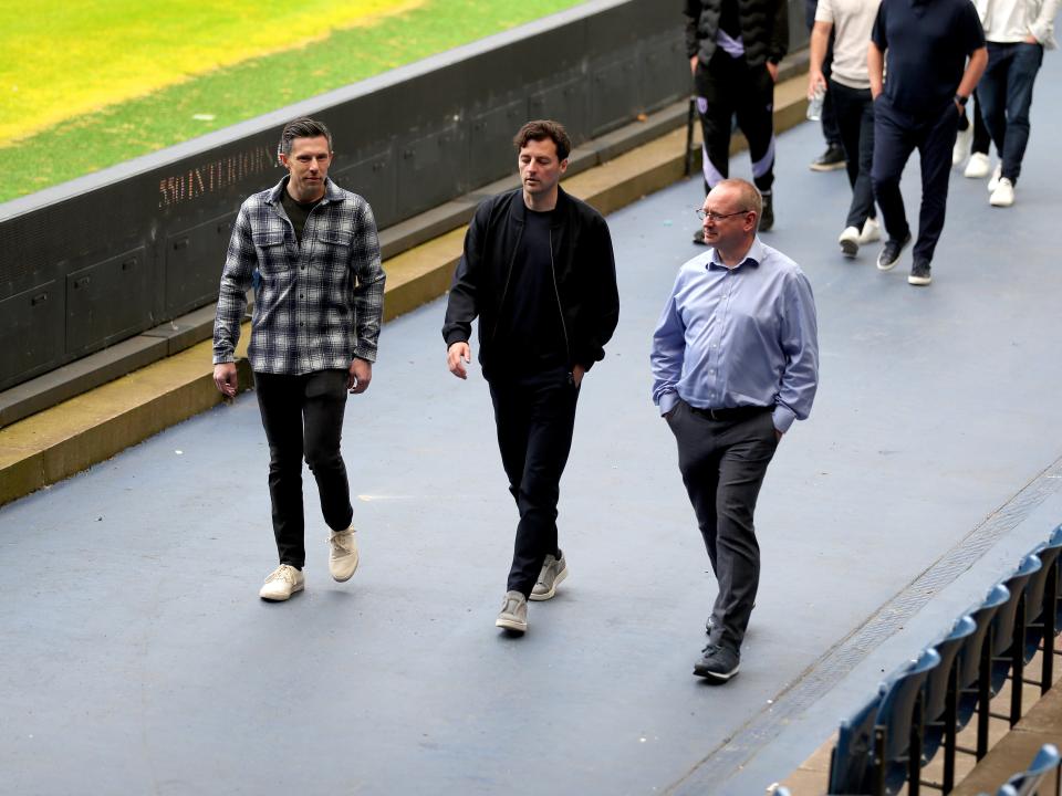 Ryan Mason walking around the side of the pitch at The Hawthorns with Andrew Nestor and Mark Miles