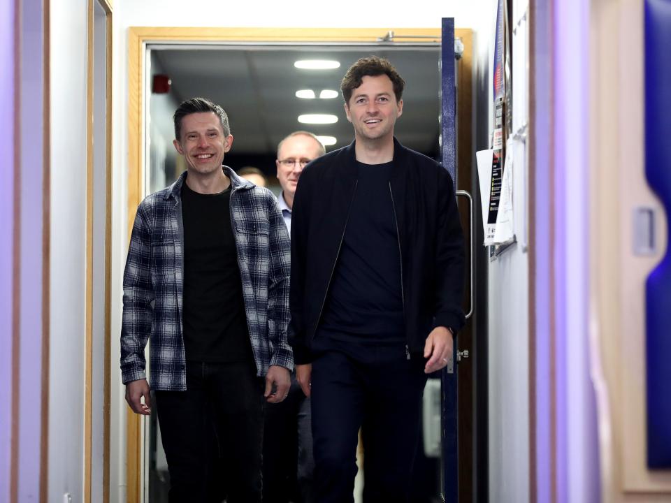 Ryan Mason and Andrew Nestor walking down a corridor at The Hawthorns