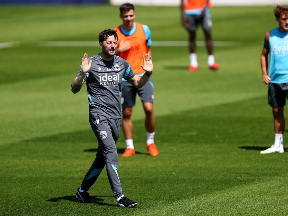 Ryan Mason delivering instructions to his players during a training session
