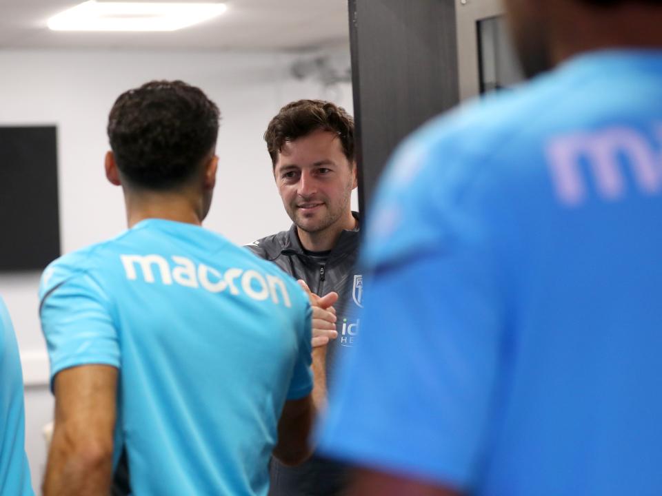 Ryan Mason greeting Albion players before a meeting