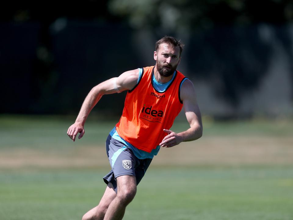 Nat Phillips running forward during a training session