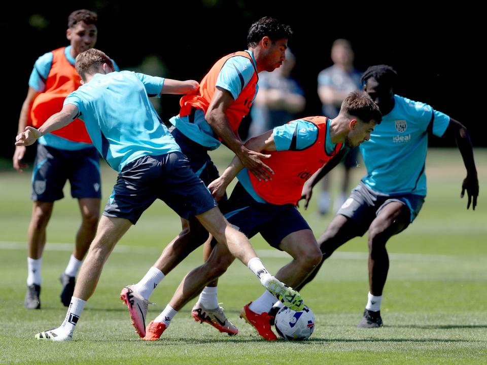 Several players battling for the ball during a training session