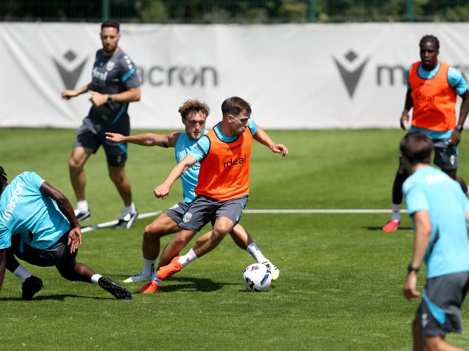 Jayson Molumby on the ball during a training session with Callum Styles behind him