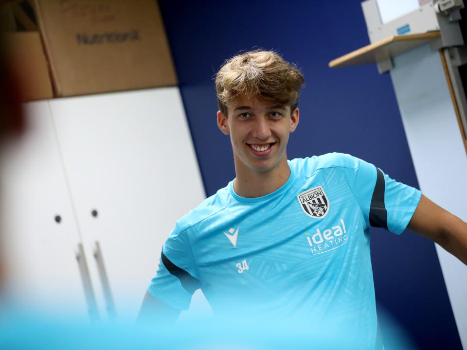 Harry Whitwell smiling at the camera while in the gym