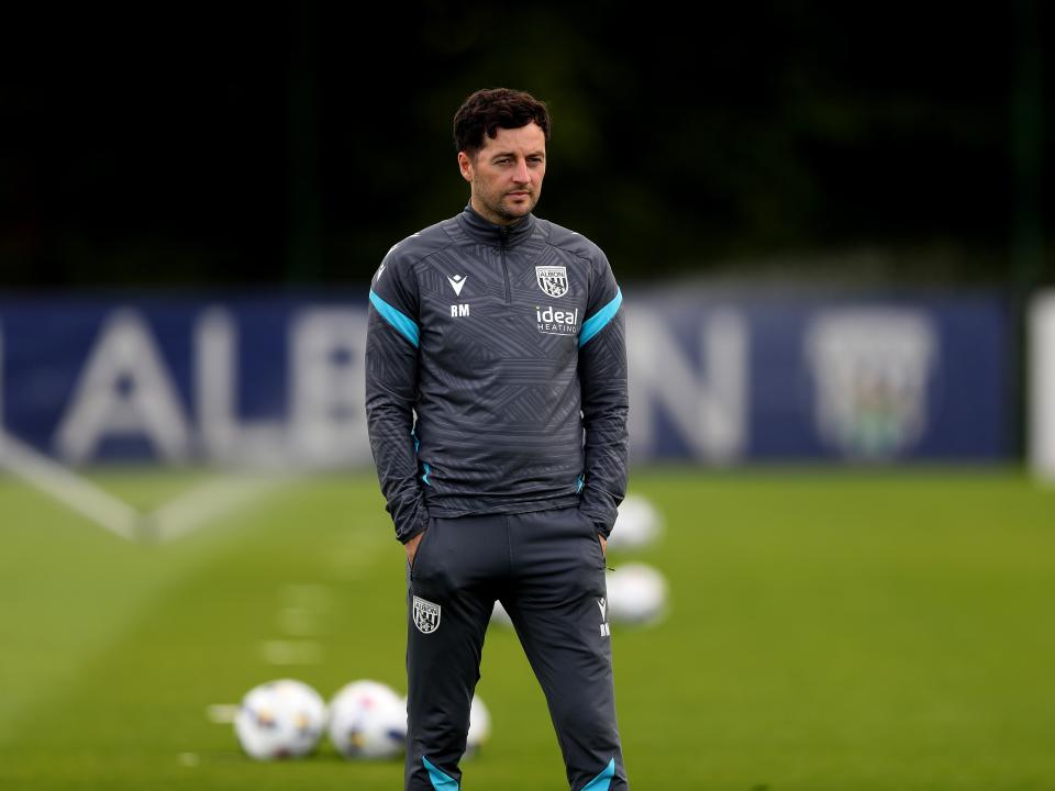 Ryan Mason watching training