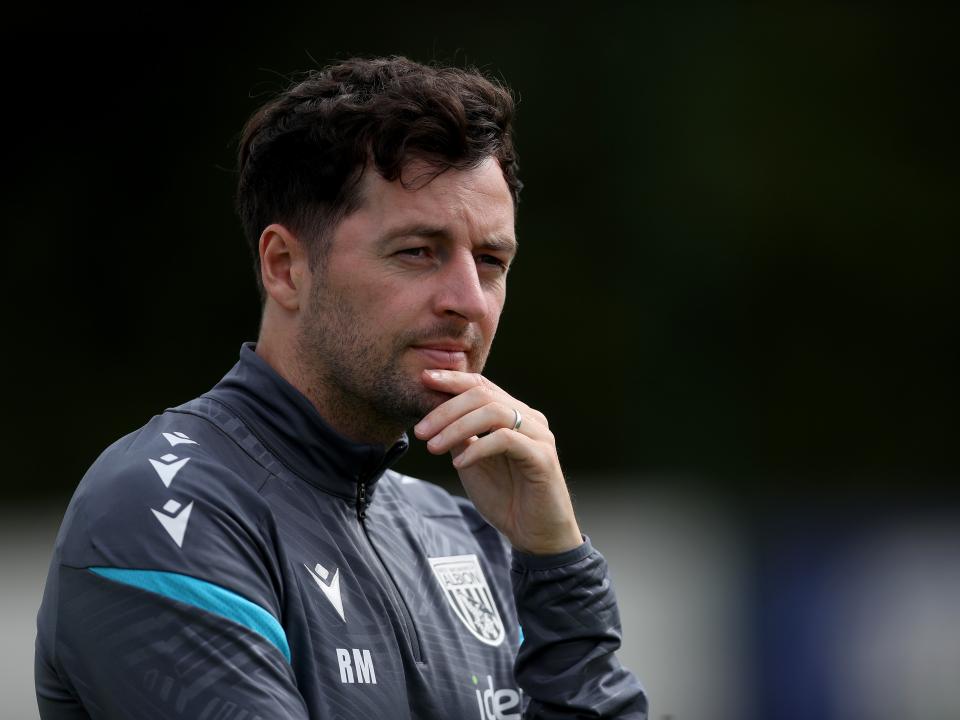 Ryan Mason watching training