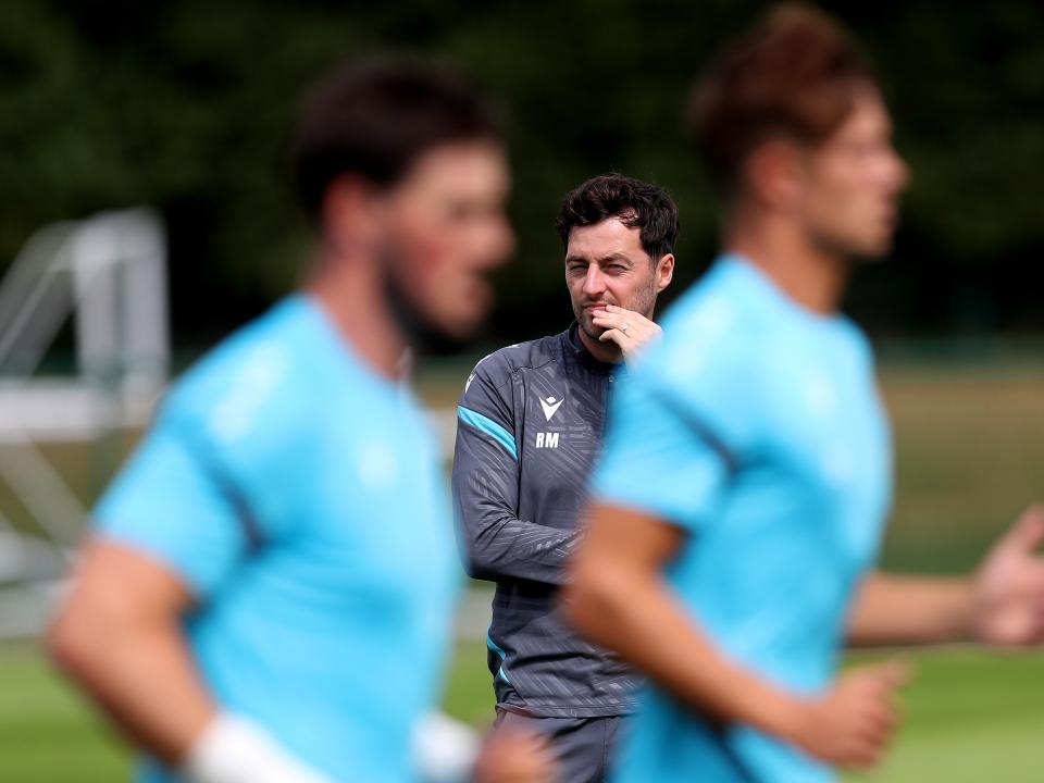 Ryan Mason watching training