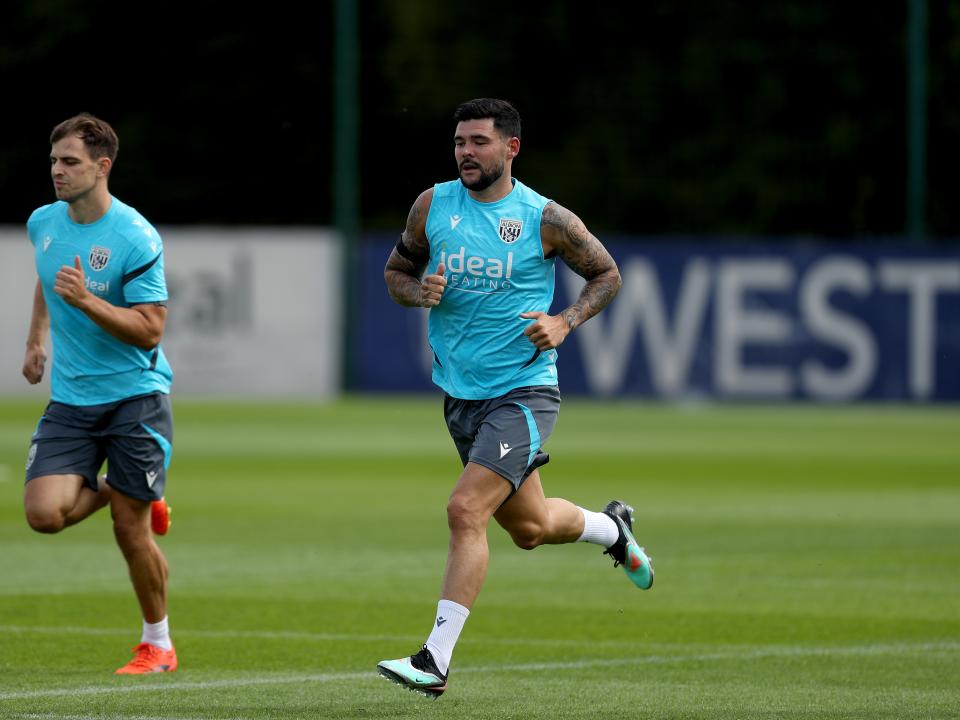 Jayson Molumby and Alex Mowatt running during a training session
