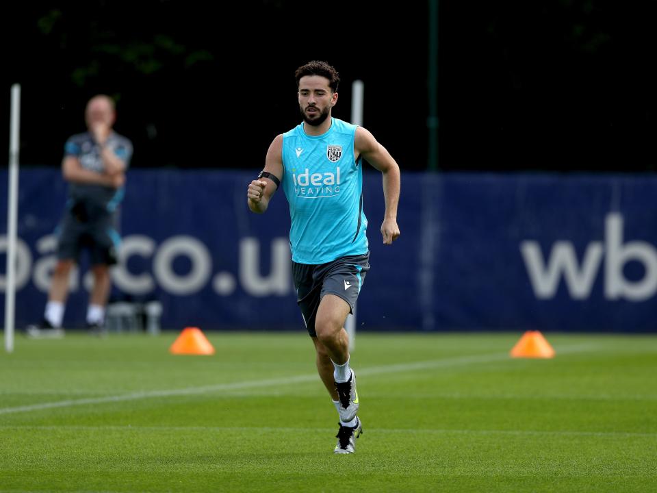 Mikey Johnston running during a training session