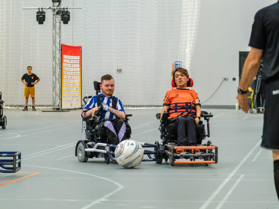 Bates and Zegarelli compete for possession.