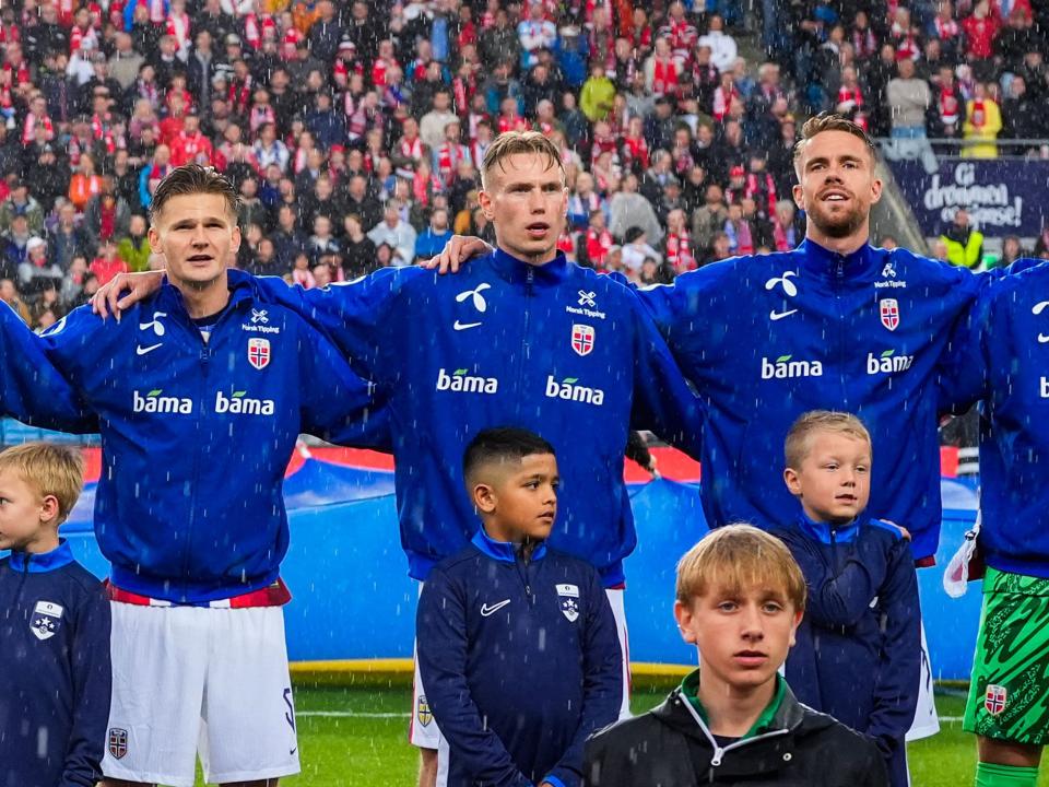 Torbjørn Heggem standing with his Norway team-mates singing the national anthem before a match with Italy