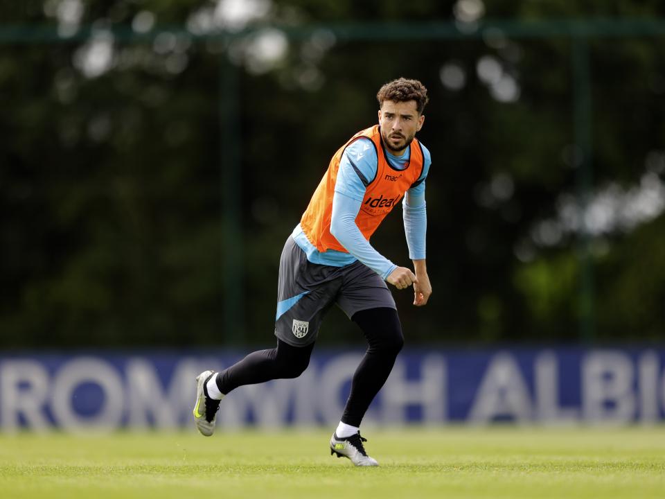 Mikey Johnston running forward looking for the ball during training