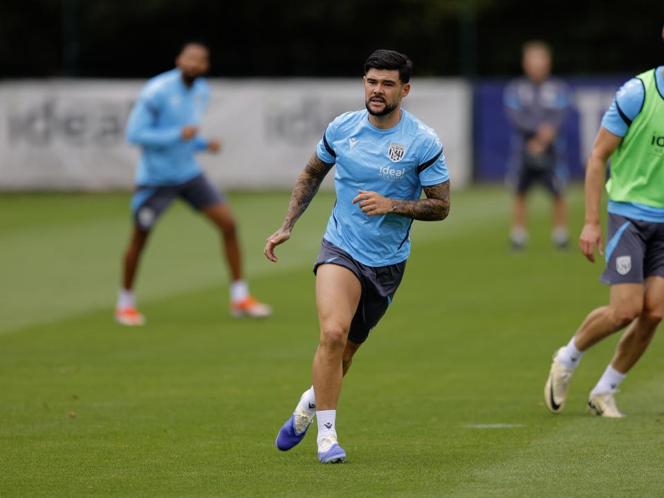 Alex Mowatt looking out for the ball during a training session