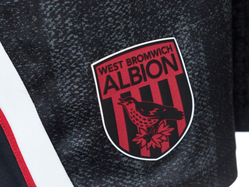 An image of the badge on the shorts of Albion's black and red third kit