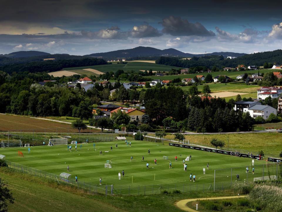 A general view of training from a vantage point with the pitch at the bottom of the hills