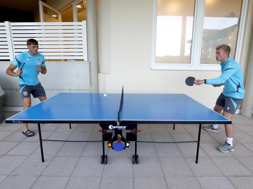 Caleb Taylor and Aune Heggebø playing table tennis