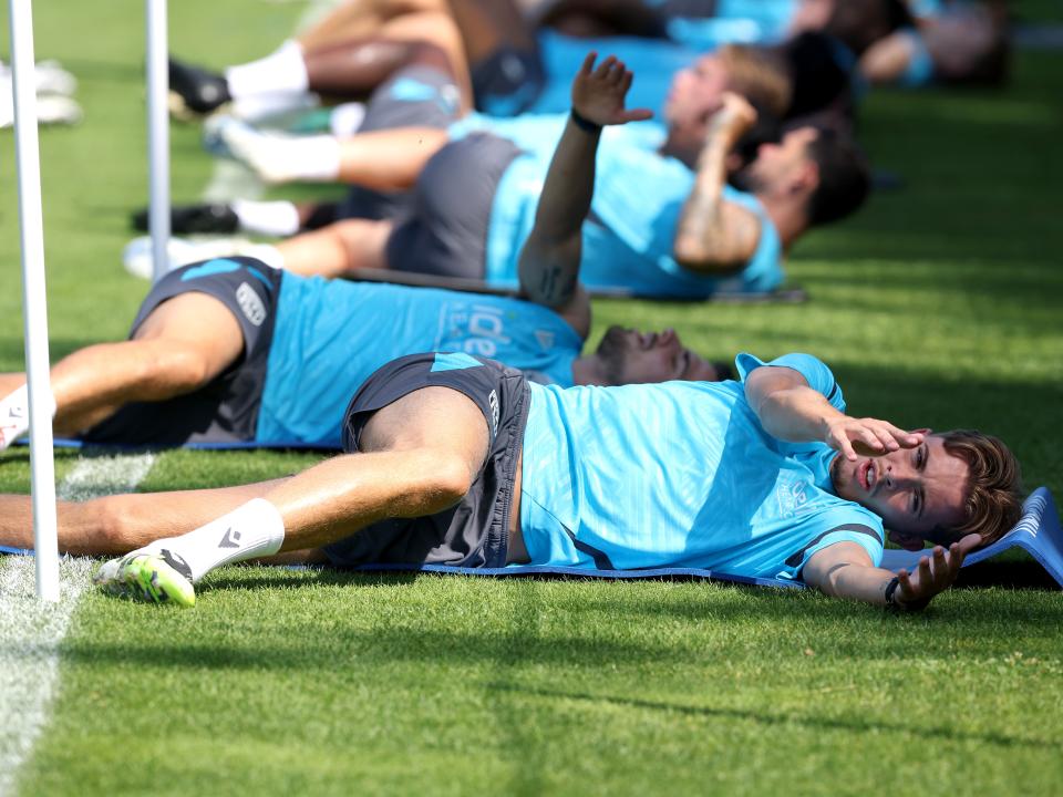 Albion players stretching before a training session