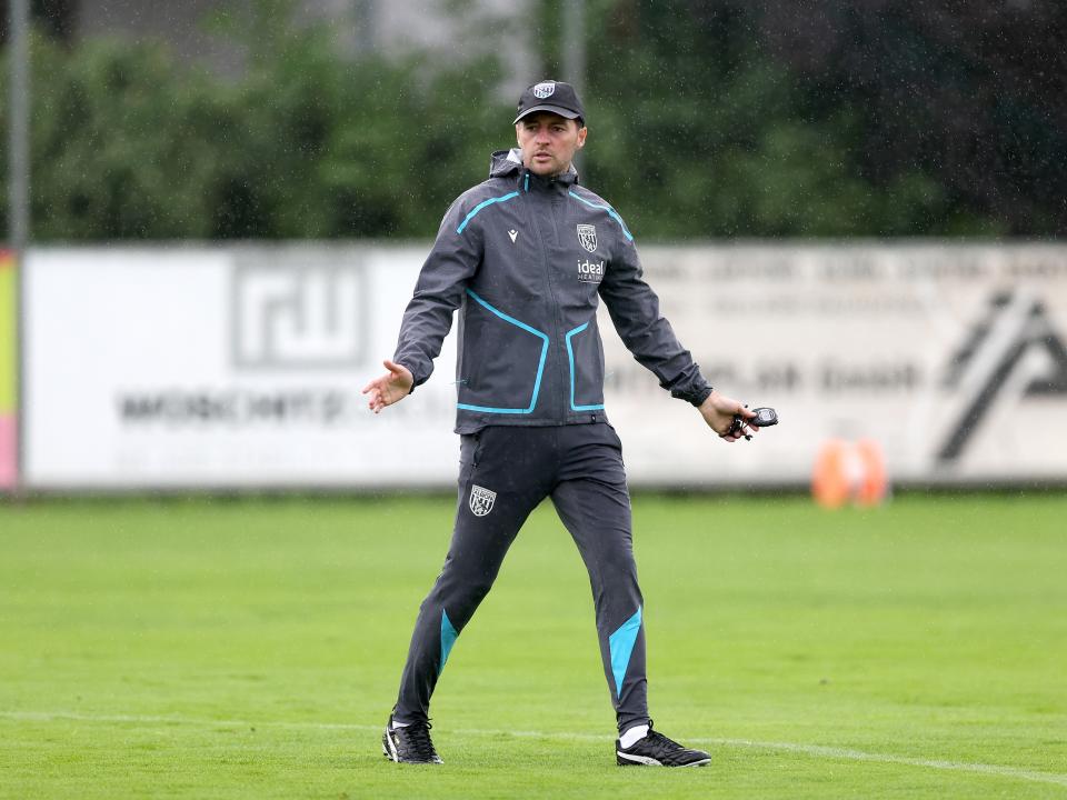 Ryan Mason coaching during a training session in the rain