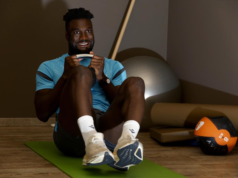 Daryl Dike working in the gym with a kettlebell weight