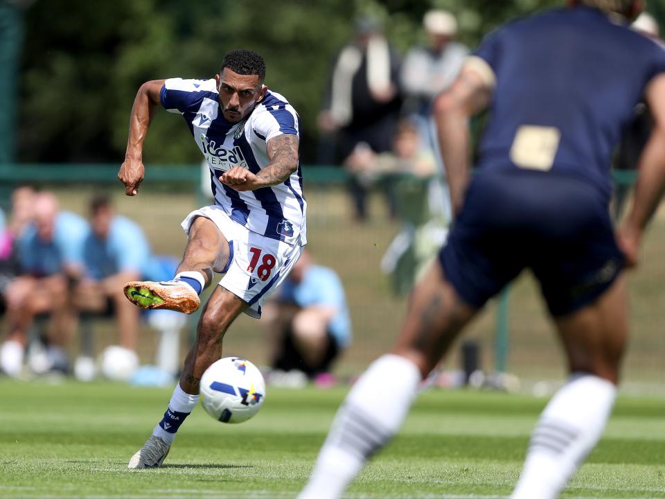 Karlan Grant striking the ball against Port Vale 